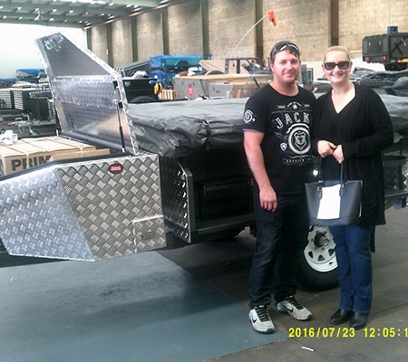 David and Tanija Windon take ownership of their new Mars camper trailer at the company's expanded fa