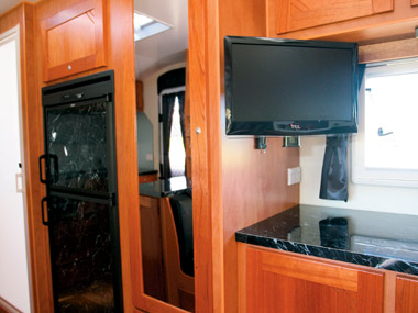 Sunland Caravans Blue Heeler TV and kitchen