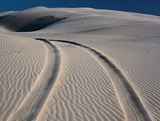 tire tracks on the sand dunes