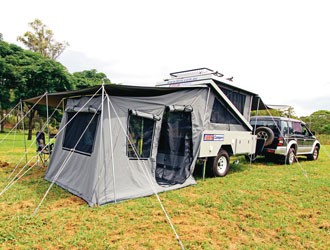 The full awning shades, the tent, and the front of the Brix Z Camper.