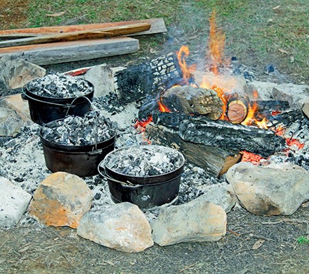 Try slow cooking with just a handful of coals, for fall-off-the-bone soft meat.