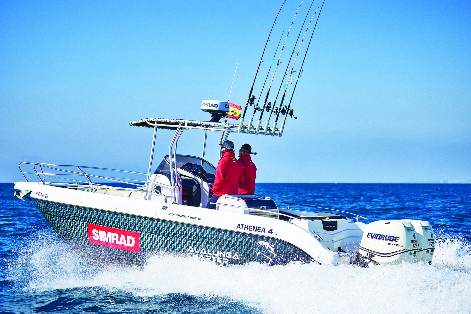 A boat with Simrad branding travels at speed, kicking up water