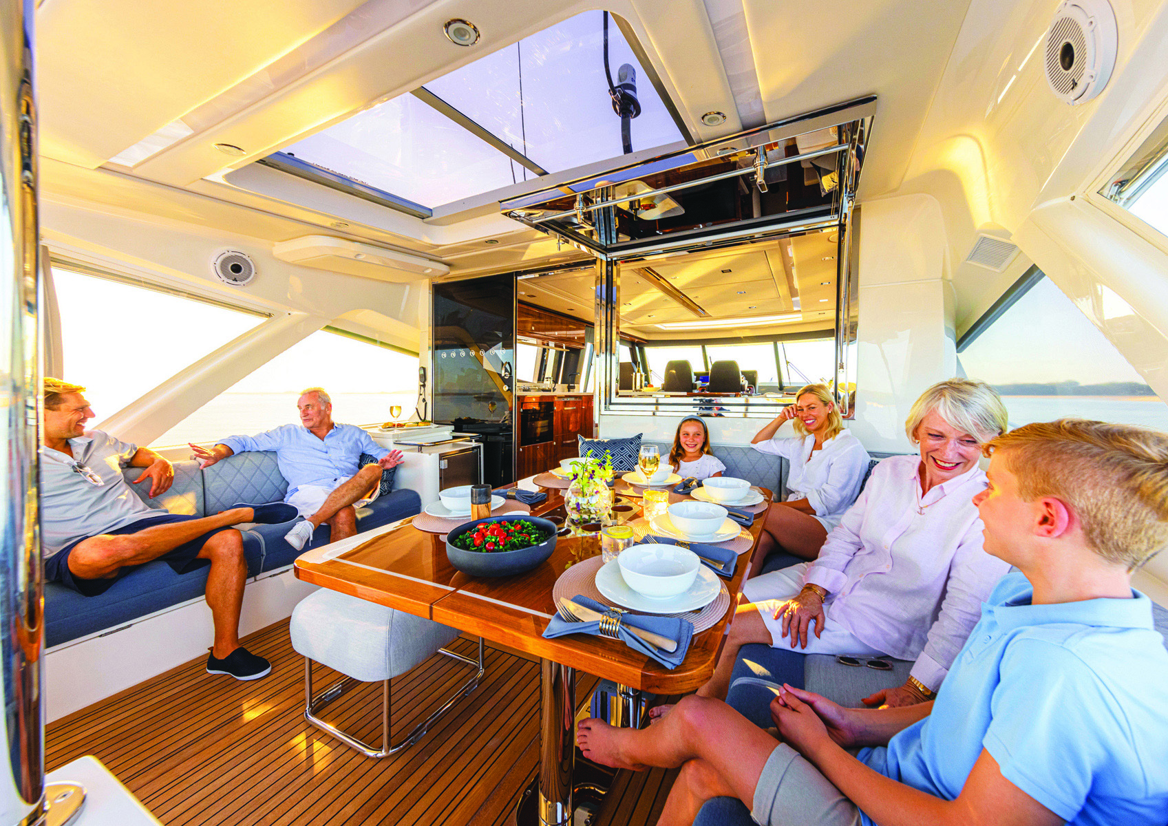 People sitting around a table on a yacht