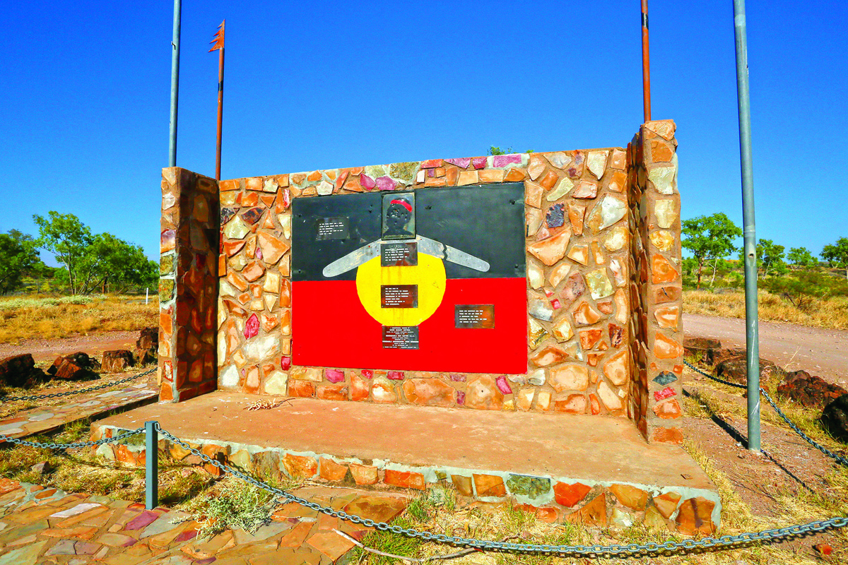 The Aboriginal flag on an Indigenous memorial
