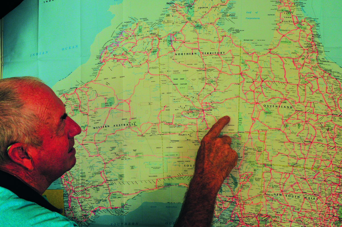 Pointing to a map of Australia to decide where to travel to