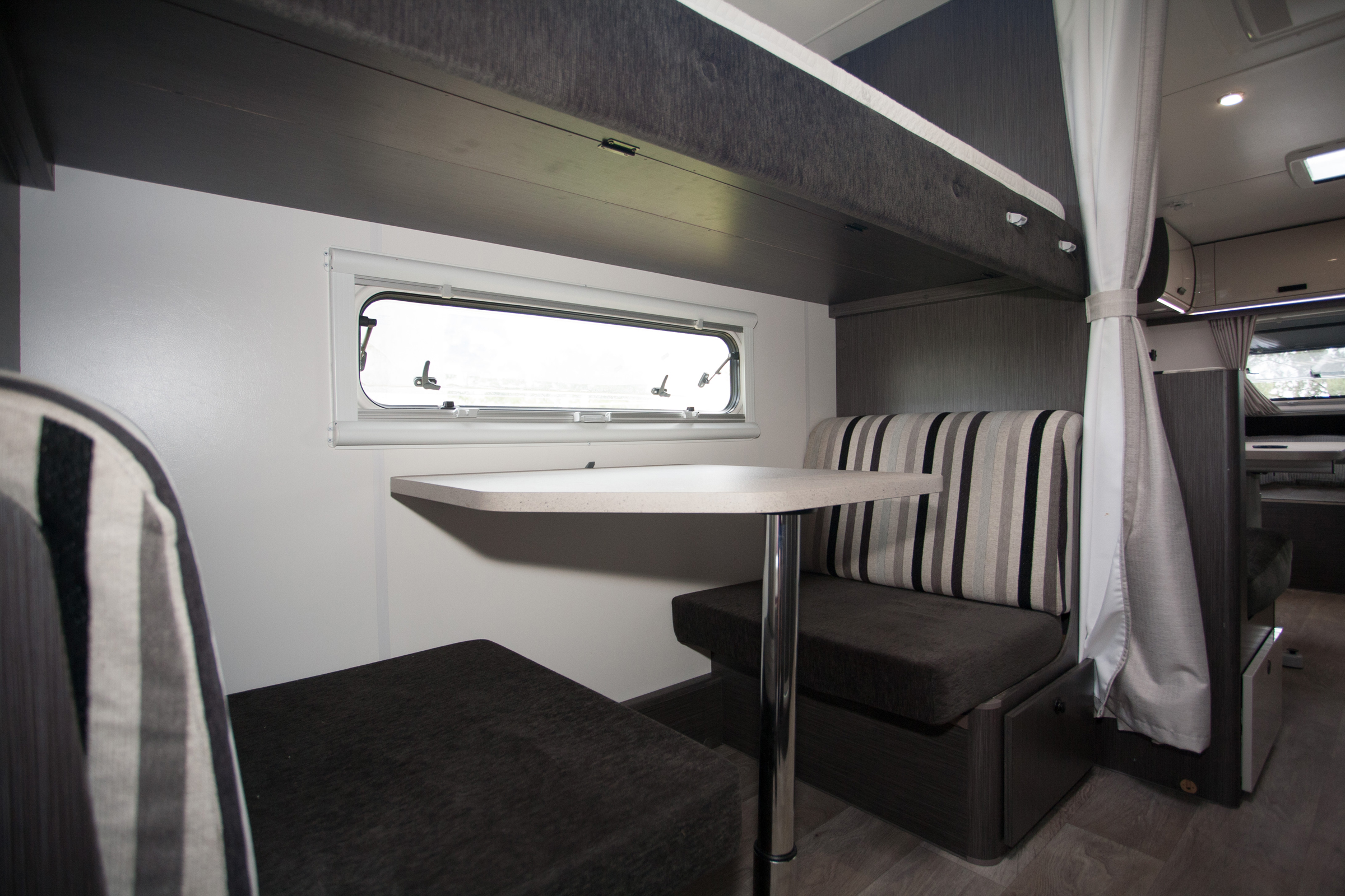 The lower wall bunk converts into a two person dinette