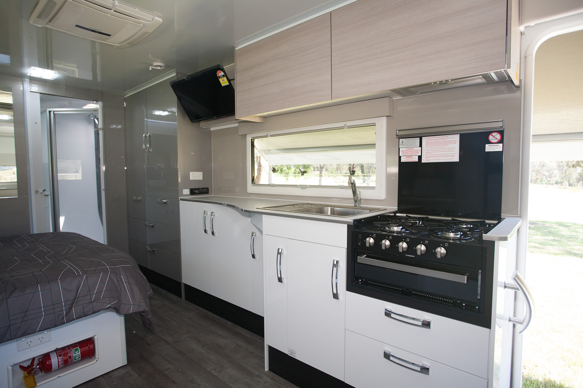 The kitchen comes equipped with a four-burner stove